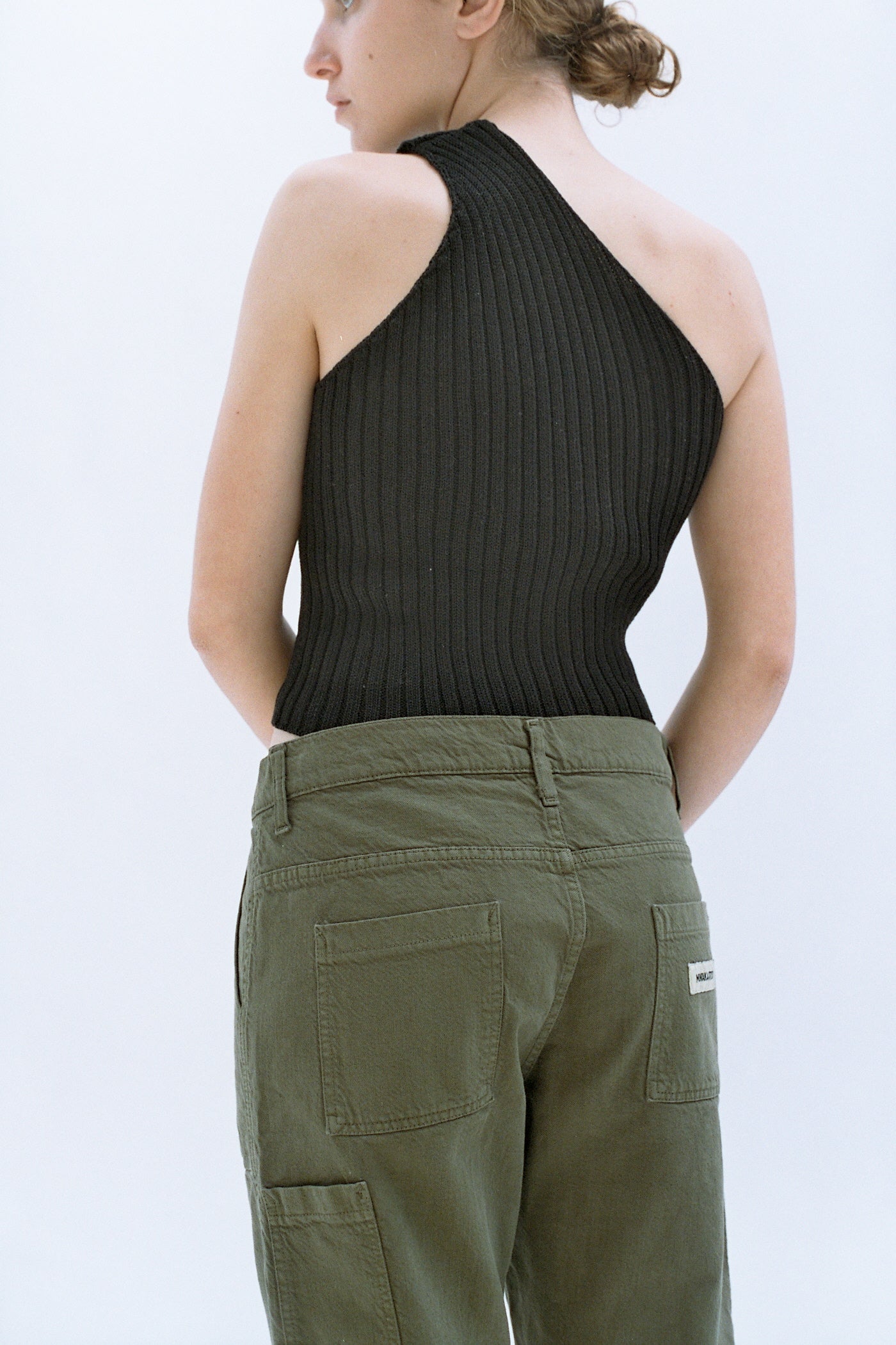 black one-shoulder knit top
